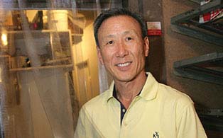 Owner standing in front of his store’s walk-in