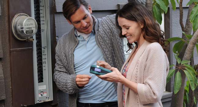 couple at meter with monitor